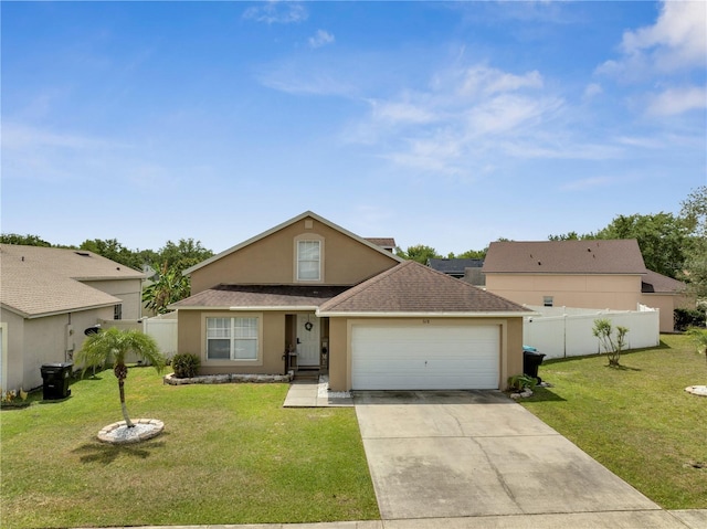 5118 Luna Negra Dr, Orlando, FL 32811 - view of front facade featuring stucco siding, an attached garage, fence, and a front yard