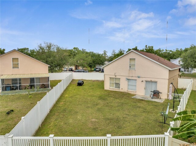 5118 Luna Negra Dr, Orlando, FL 32811 - view of yard featuring a fenced backyard