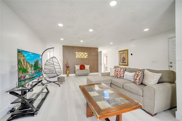 5118 Luna Negra Dr, Orlando, FL 32811 - living area with an inviting chandelier, baseboards, recessed lighting, and light wood-style floors