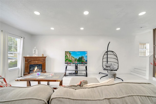 5118 Luna Negra Dr, Orlando, FL 32811 - living room with a glass covered fireplace and recessed lighting