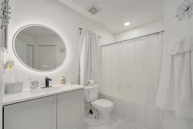 5118 Luna Negra Dr, Orlando, FL 32811 - bathroom featuring toilet, visible vents, marble finish floor, shower / bathtub combination with curtain, and vanity