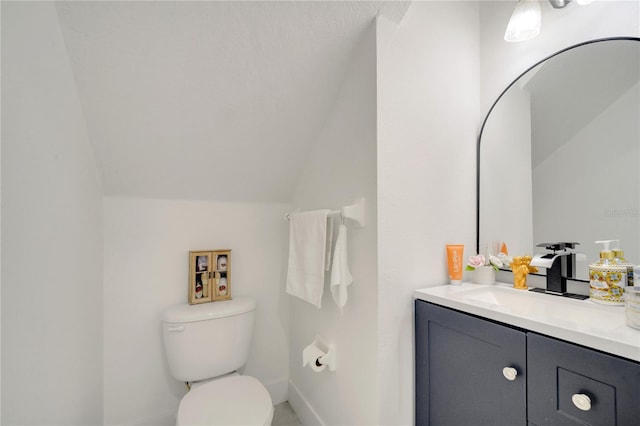 5118 Luna Negra Dr, Orlando, FL 32811 - half bathroom featuring baseboards, vaulted ceiling, vanity, and toilet