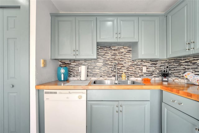5118 Luna Negra Dr, Orlando, FL 32811 - kitchen with white dishwasher, backsplash, and a sink