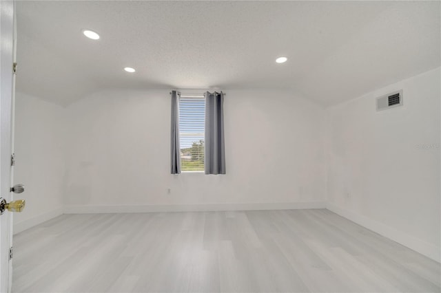5118 Luna Negra Dr, Orlando, FL 32811 - additional living space featuring vaulted ceiling, visible vents, recessed lighting, and light wood-style flooring