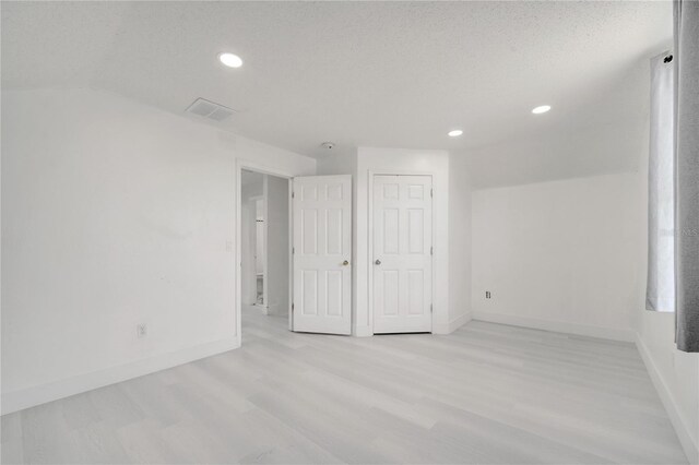 5118 Luna Negra Dr, Orlando, FL 32811 - unfurnished bedroom featuring baseboards, wood finished floors, and recessed lighting