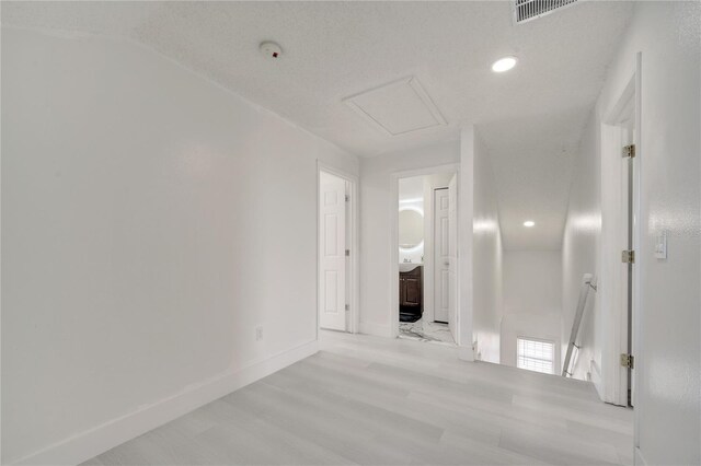 5118 Luna Negra Dr, Orlando, FL 32811 - unfurnished room featuring recessed lighting, light wood-type flooring, visible vents, and baseboards