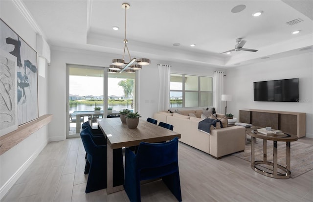 2725 Serenity Meadow Dr, Kissimmee, FL 34744 - dining room with recessed lighting, ornamental molding, visible vents, and a raised ceiling