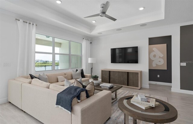 2725 Serenity Meadow Dr, Kissimmee, FL 34744 - living area featuring recessed lighting, a raised ceiling, ornamental molding, baseboards, and ceiling fan