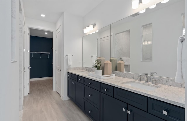 2725 Serenity Meadow Dr, Kissimmee, FL 34744 - full bathroom featuring a sink, double vanity, visible vents, a spacious closet, and recessed lighting
