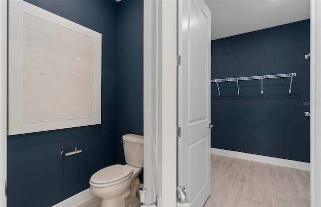 2725 Serenity Meadow Dr, Kissimmee, FL 34744 - bathroom with baseboards and toilet