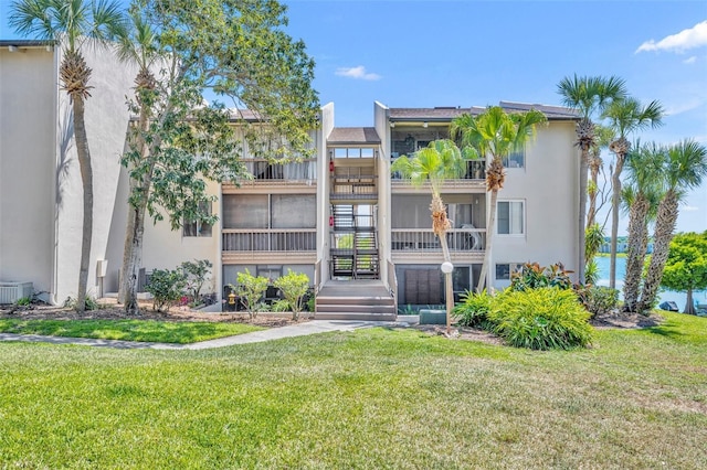 574 Orange Dr Unit 78, Altamonte Springs, FL 32701 - view of property featuring central AC and stairway
