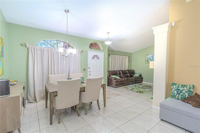 dining room featuring vaulted ceiling, an inviting chandelier, and light tile patterned floors