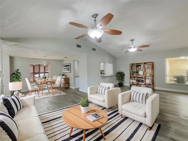 5037 Bermuda Cir Unit 10, Orlando, FL 32808 - living room featuring baseboards, visible vents, and light wood-type flooring