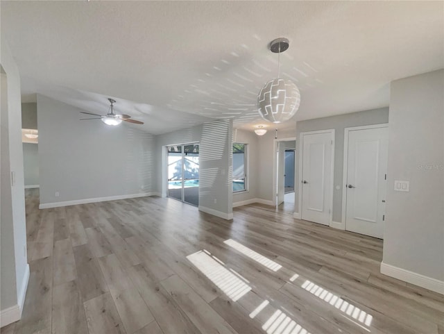5037 Bermuda Cir Unit 10, Orlando, FL 32808 - interior space featuring light wood-style floors, baseboards, and ceiling fan