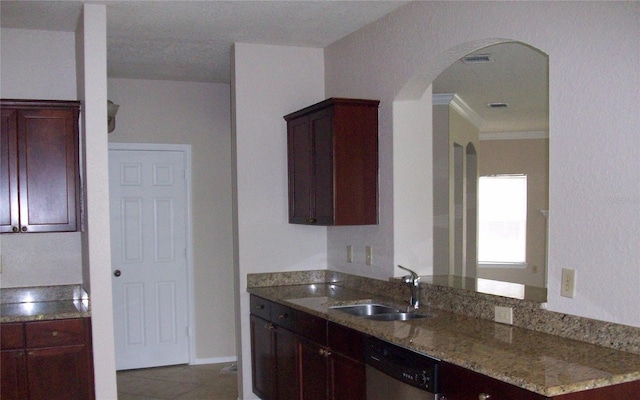 kitchen featuring light stone countertops, a sink, light tile patterned flooring, arched walkways, and dishwasher