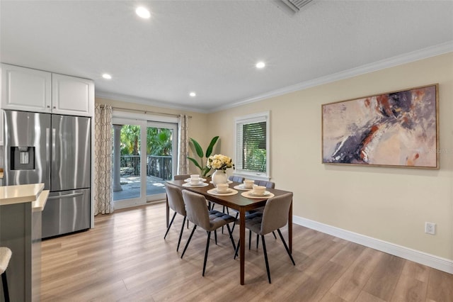 1105 Lake Nettie Dr, Eustis, FL 32726 - dining room featuring light wood finished floors, crown molding, and recessed lighting
