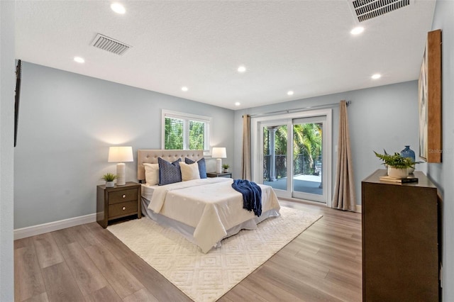 1105 Lake Nettie Dr, Eustis, FL 32726 - bedroom featuring access to outside, light wood-style flooring, and recessed lighting