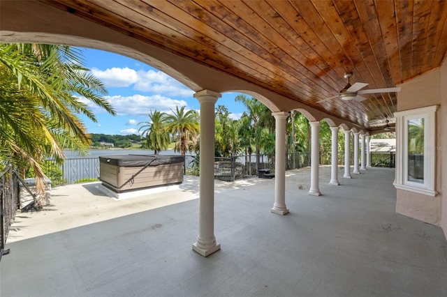1105 Lake Nettie Dr, Eustis, FL 32726 - fenced backyard with a hot tub, a patio, and ceiling fan