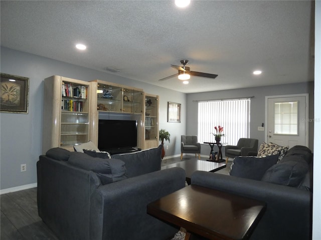 9313 Pavillion Dr, Orlando, FL 32825 - living area with dark wood-style floors, a textured ceiling, baseboards, recessed lighting, and ceiling fan