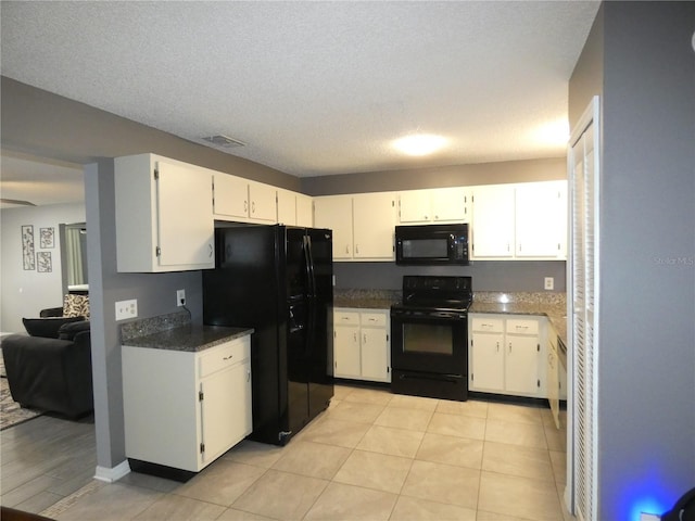 9313 Pavillion Dr, Orlando, FL 32825 - kitchen featuring visible vents, white cabinetry, and black appliances