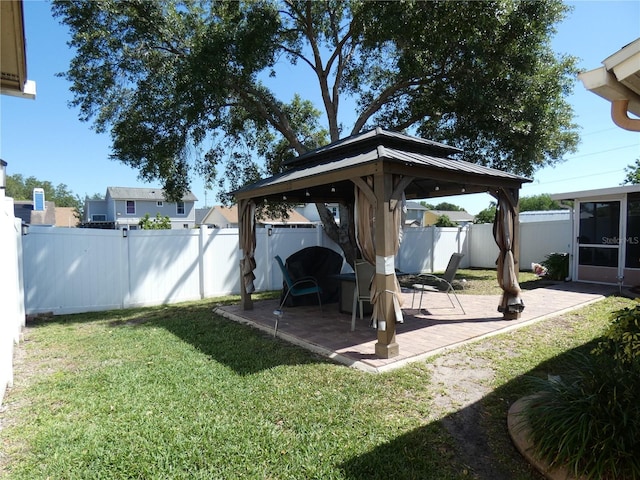 9313 Pavillion Dr, Orlando, FL 32825 - view of yard featuring a patio area, a fenced backyard, and a gazebo