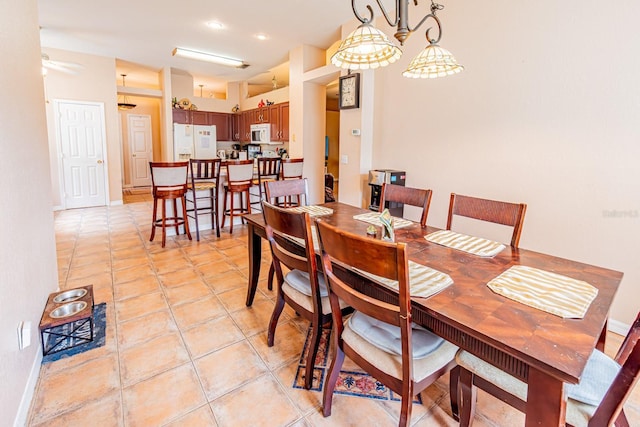 dining space featuring recessed lighting, baseboards, and light tile patterned floors