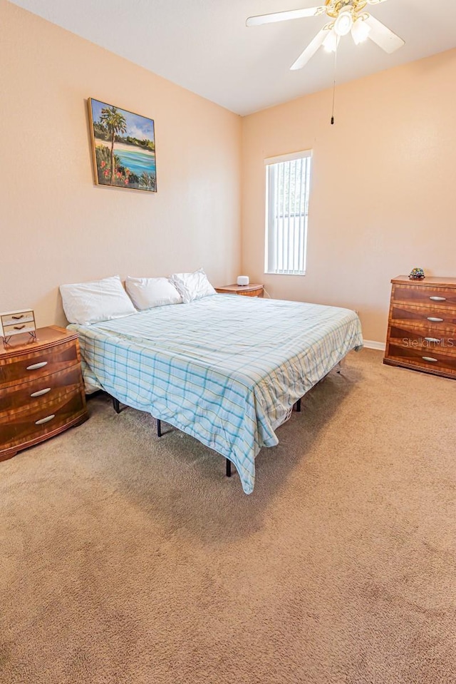 bedroom featuring ceiling fan and carpet flooring