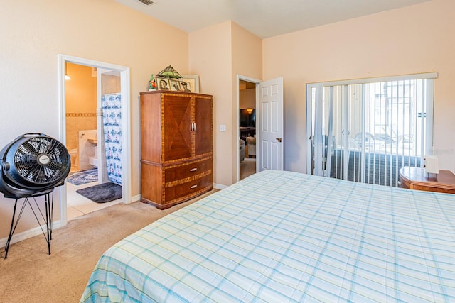 bedroom featuring visible vents, baseboards, light carpet, and connected bathroom