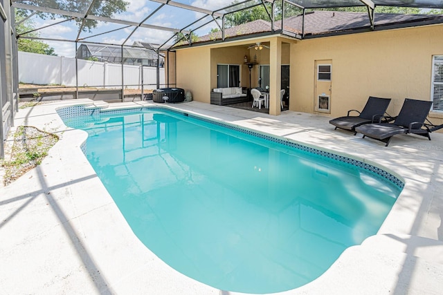 view of pool with a fenced in pool, a ceiling fan, a patio area, an outdoor living space, and a lanai