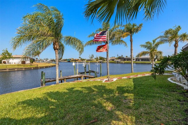 9277 St Paul Dr, Port Charlotte, FL 33981 - dock area with a lawn and a water view