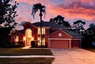 3020 Zaharias Dr, Orlando, FL 32837 - view of front of home featuring a garage and driveway