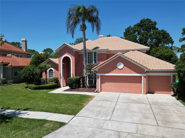 3020 Zaharias Dr, Orlando, FL 32837 - mediterranean / spanish-style house featuring a garage, a front lawn, stucco siding, concrete driveway, and a tile roof