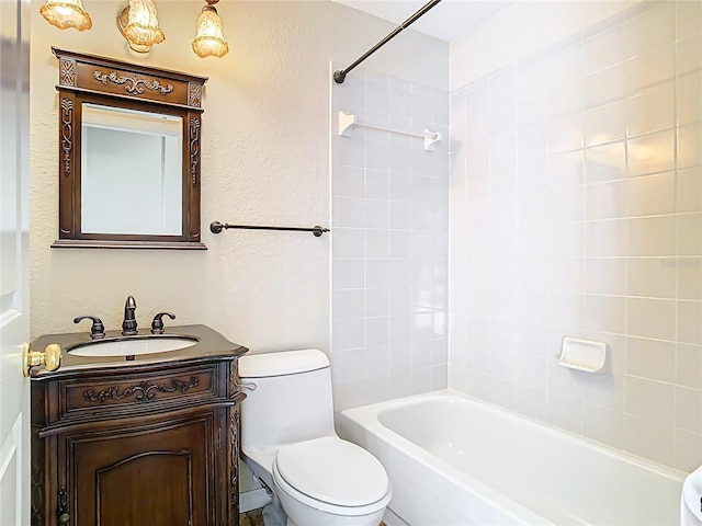 3020 Zaharias Dr, Orlando, FL 32837 - bathroom featuring vanity, washtub / shower combination, a textured wall, and toilet