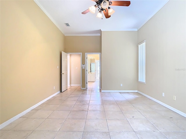 3020 Zaharias Dr, Orlando, FL 32837 - spare room featuring visible vents, ornamental molding, baseboards, a ceiling fan, and light tile patterned floors