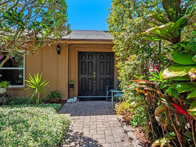 1139 Fairway Dr, Winter Park, FL 32792 - entrance to property featuring roof with shingles and board and batten siding