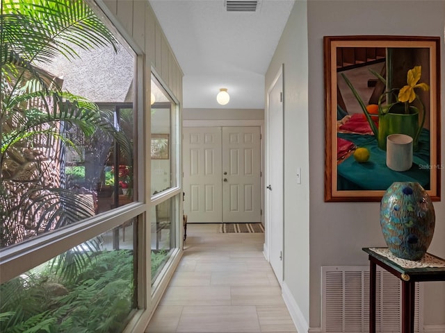 1139 Fairway Dr, Winter Park, FL 32792 - hallway featuring baseboards and plenty of natural light