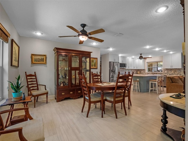 1139 Fairway Dr, Winter Park, FL 32792 - dining area with a ceiling fan, a textured ceiling, light wood-style floors, and recessed lighting