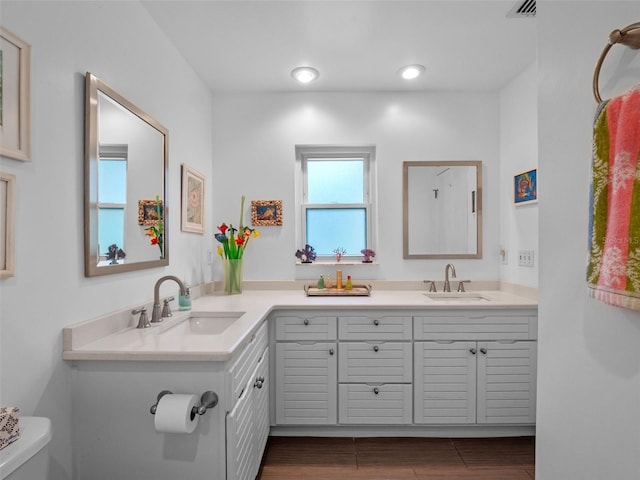 1139 Fairway Dr, Winter Park, FL 32792 - full bathroom with toilet, double vanity, and wood finished floors