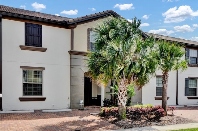8814 Geneve Ct, Kissimmee, FL 34747 - mediterranean / spanish-style home featuring a tiled roof and stucco siding