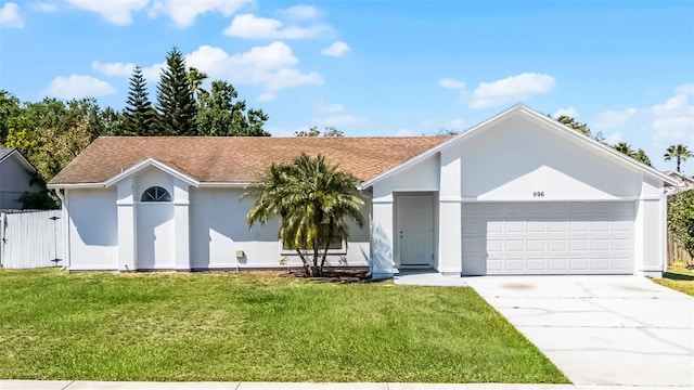 ranch-style house with stucco siding, an attached garage, driveway, roof with shingles, and a front yard