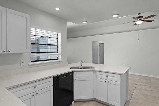 kitchen featuring white cabinets, a peninsula, black dishwasher, and a sink