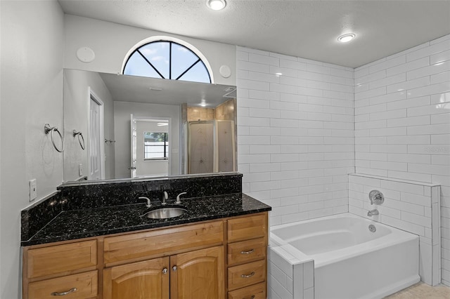 bathroom featuring vanity and a textured ceiling