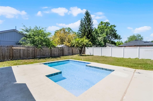 view of swimming pool with a fenced backyard, a patio area, a yard, and a fenced in pool