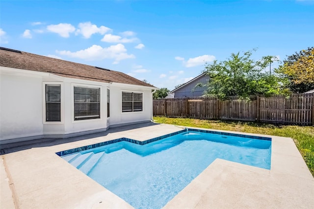 view of pool with a patio area, a fenced in pool, and a fenced backyard