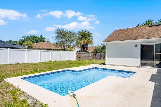 view of pool with a lawn, a patio area, a fenced backyard, and a fenced in pool