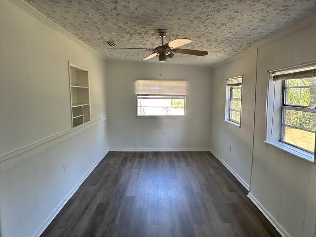 804 Little Wekiwa Dr, Altamonte Springs, FL 32714 - spare room with ornamental molding, a wealth of natural light, a ceiling fan, and dark wood-type flooring