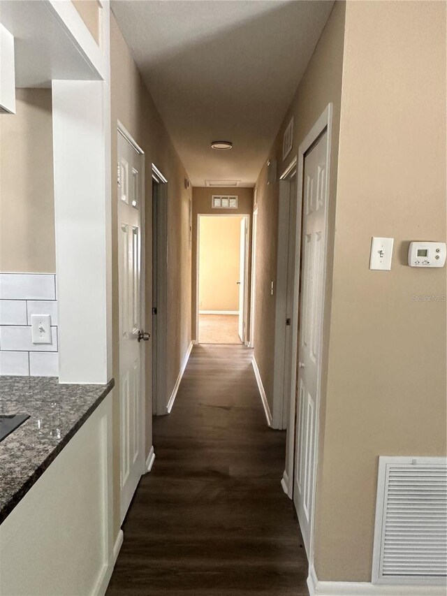 804 Little Wekiwa Dr, Altamonte Springs, FL 32714 - hallway featuring dark wood finished floors, visible vents, and baseboards