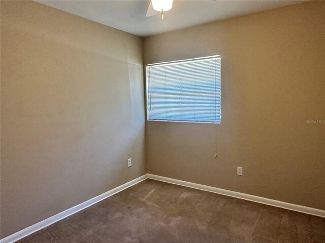 804 Little Wekiwa Dr, Altamonte Springs, FL 32714 - empty room with baseboards, a ceiling fan, and dark colored carpet