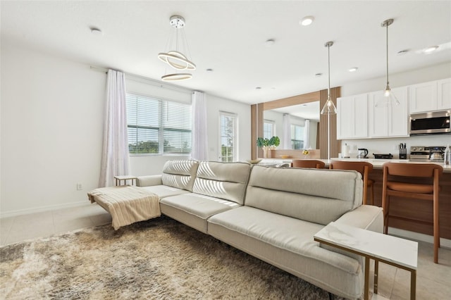 646 Longboat Dr, Davenport, FL 33896 - living room featuring recessed lighting, baseboards, and light tile patterned floors