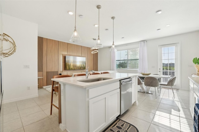646 Longboat Dr, Davenport, FL 33896 - kitchen featuring a sink, dishwasher, pendant lighting, light countertops, and white cabinetry
